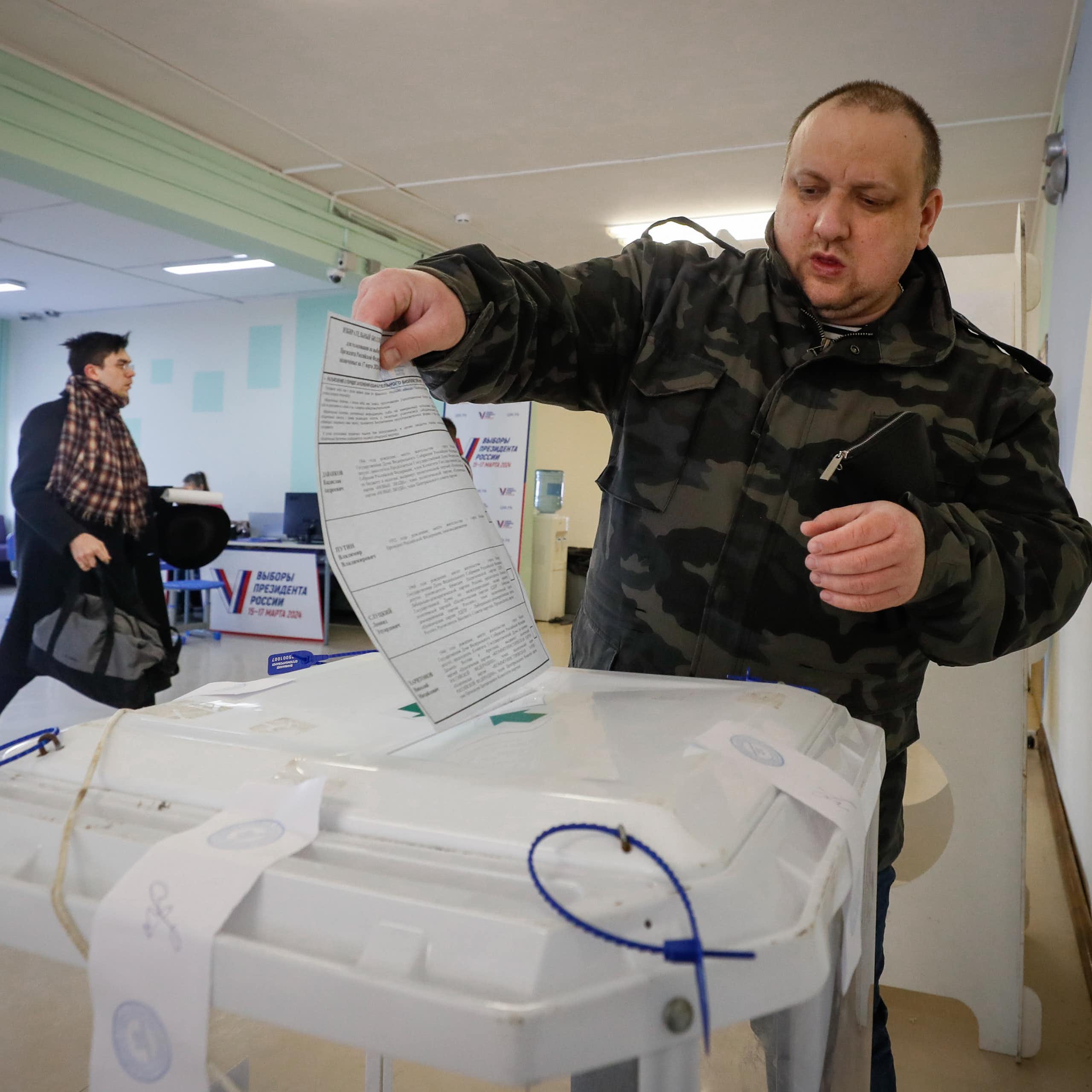 A Russian man casts his ballot in the 2024 presidential elections