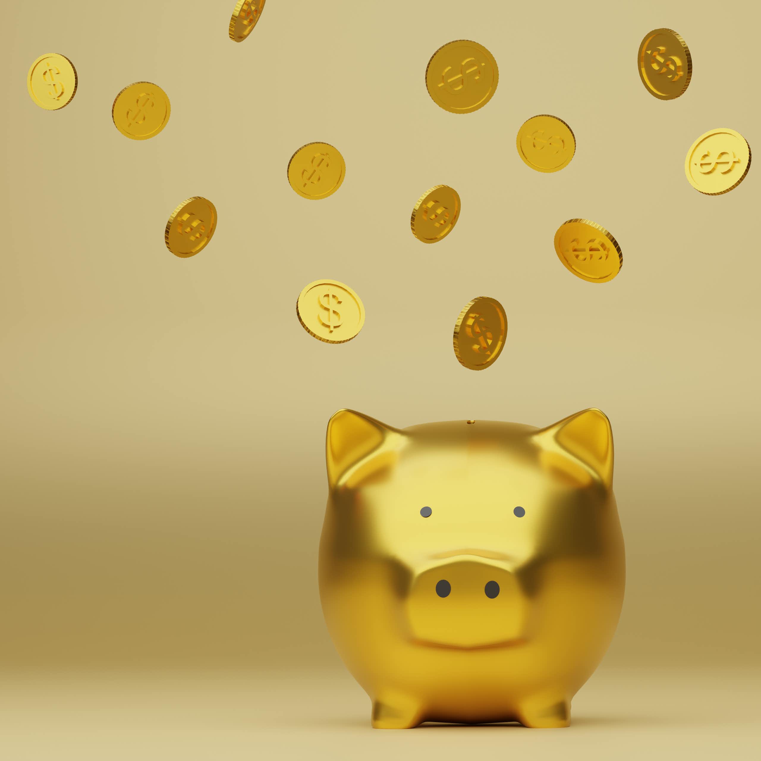 A golden piggy bank with gold coins flying around it.