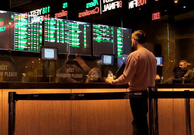 A customer makes a sports bet at the Borgata casino in Atlantic City N.J. on March 17, 2022, just before the March Madness NCAA college tournament begins.