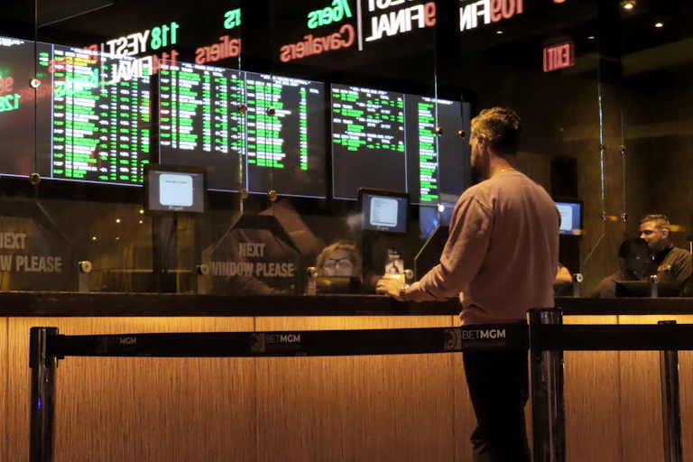 A customer makes a sports bet at the Borgata casino in Atlantic City N.J. on March 17, 2022, just before the March Madness NCAA college tournament begins.