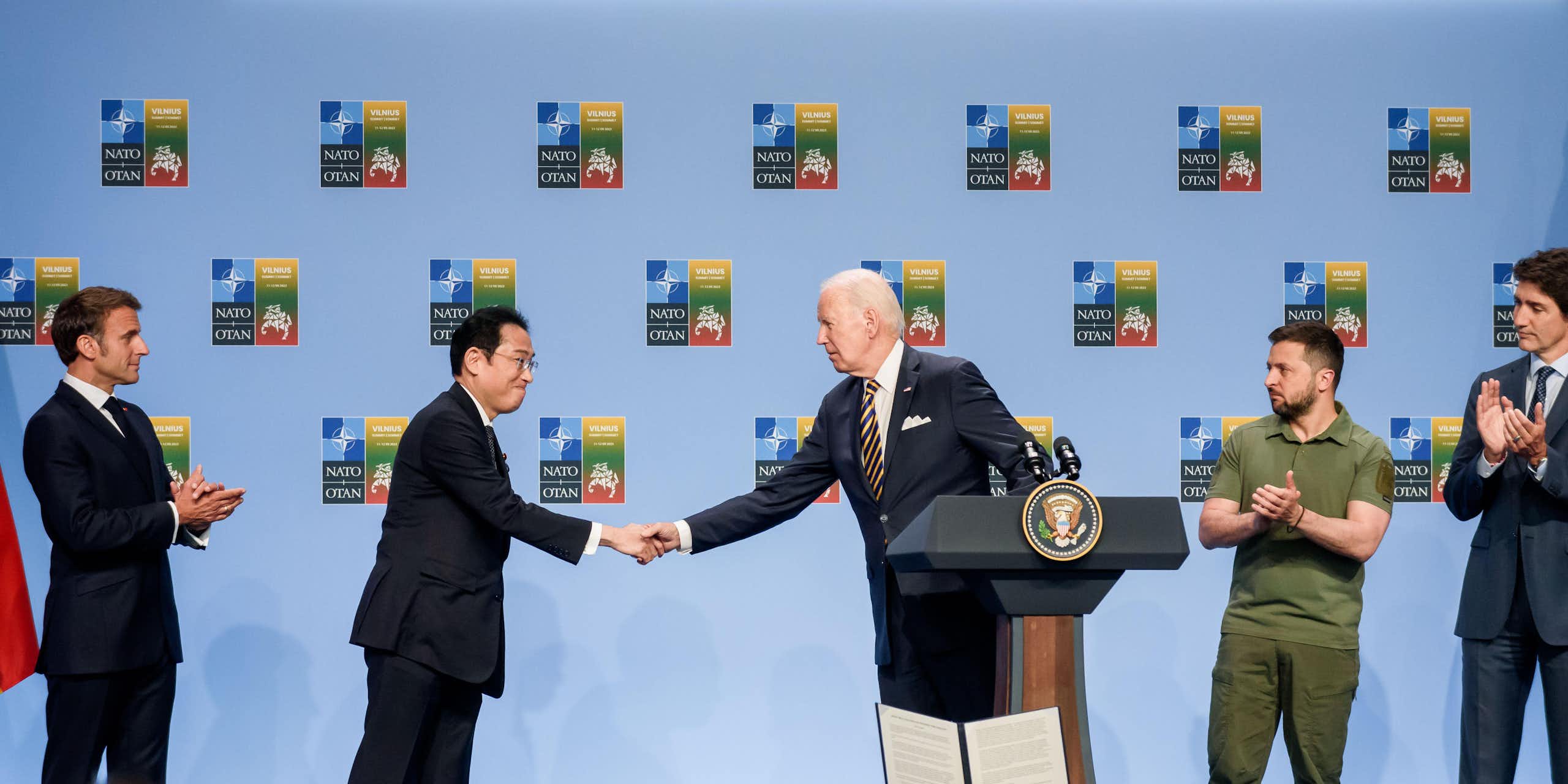 Japanese prime minister Fumio Kishida shakes hands with Joe Biden as Ukrainian president VOlodymyr Zelensky and G7 leaders watchnounce a Joint Declaration of Support to Ukraine , during NATO SUMMIT 2023