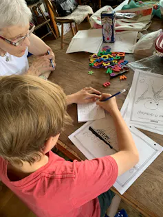 A child practising writing.