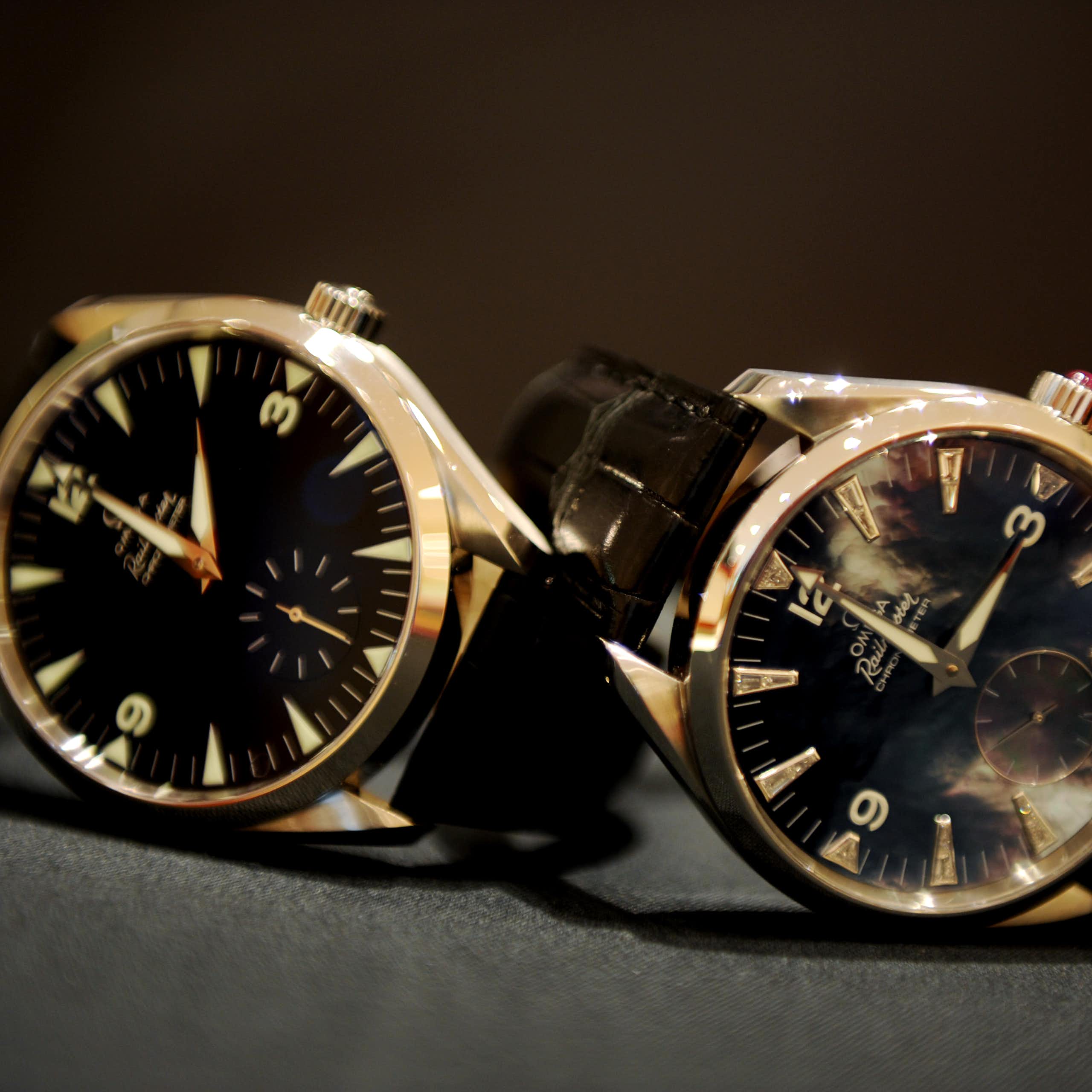 Two watches with clock faces showing the two times before and after daylight saving changes