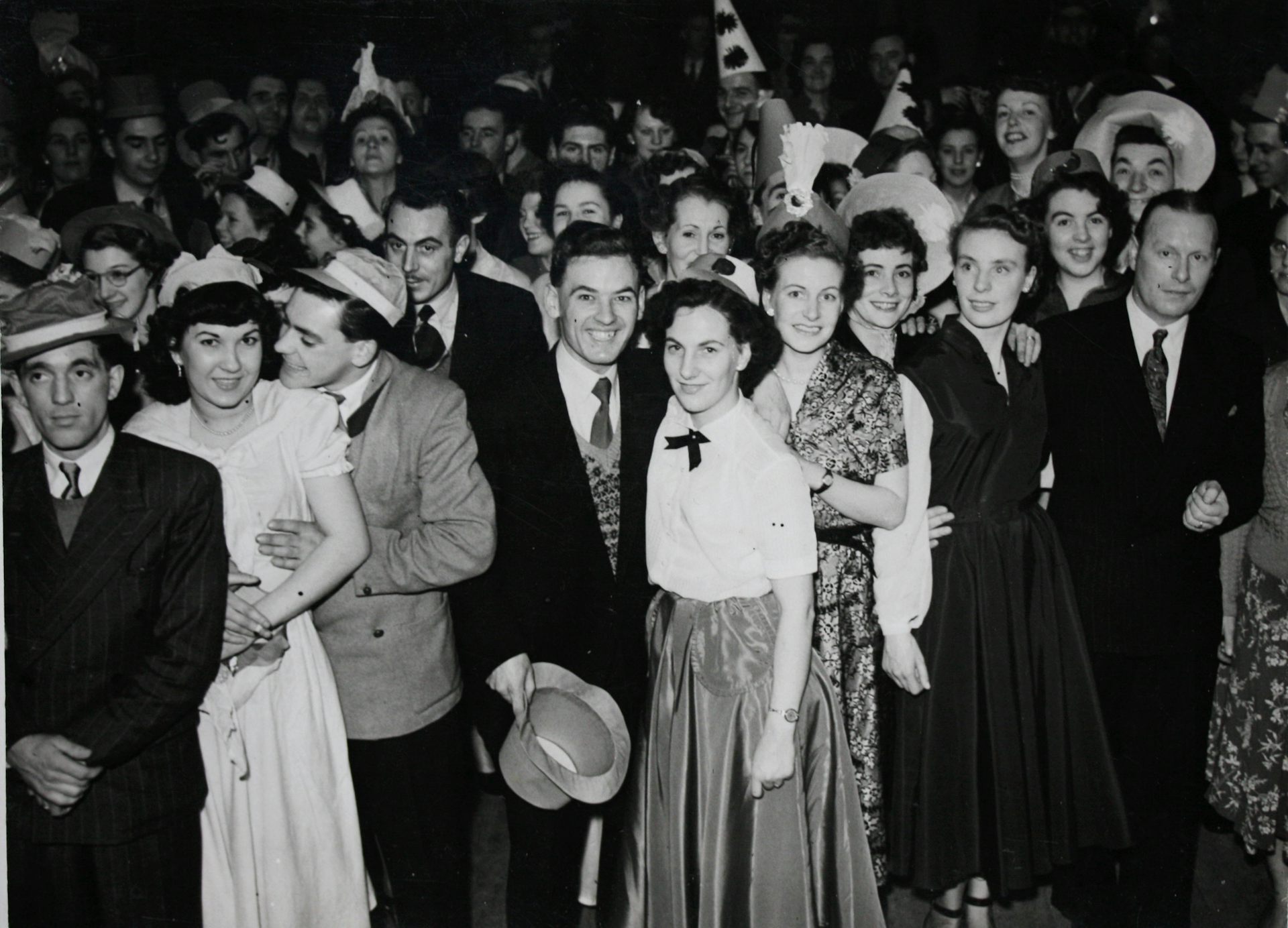An archival photograph of young people in the 1950s.