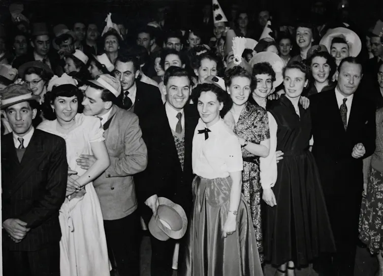 An archival photograph of young people in the 1950s.