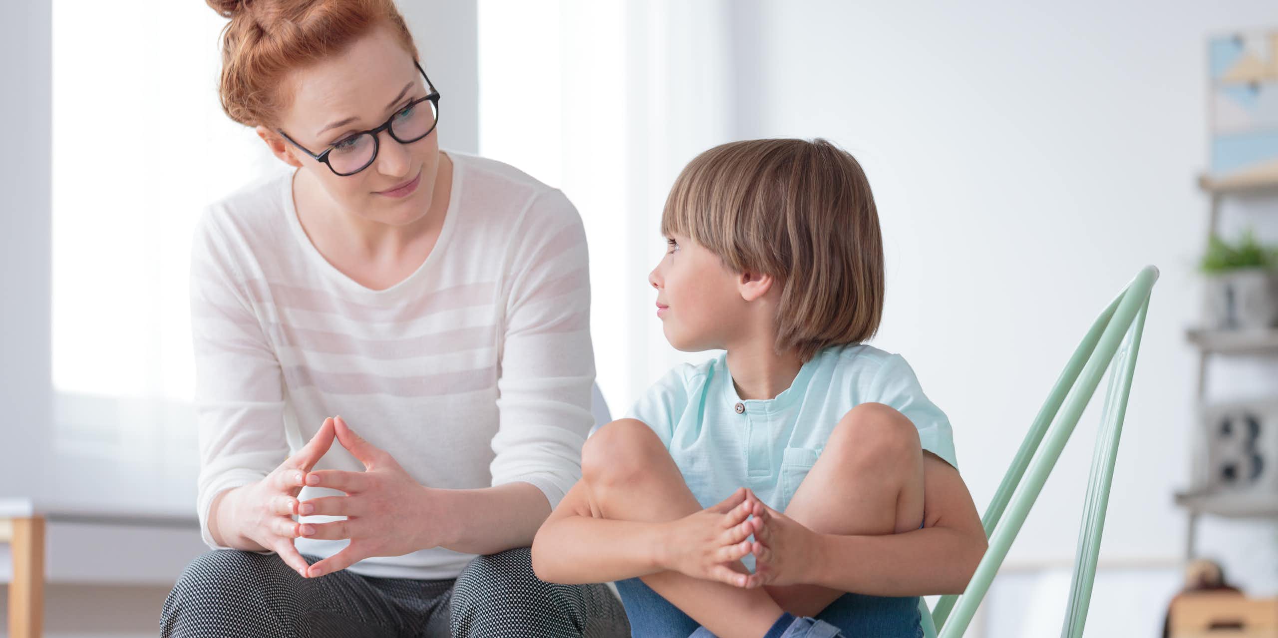 Woman talking to young boy