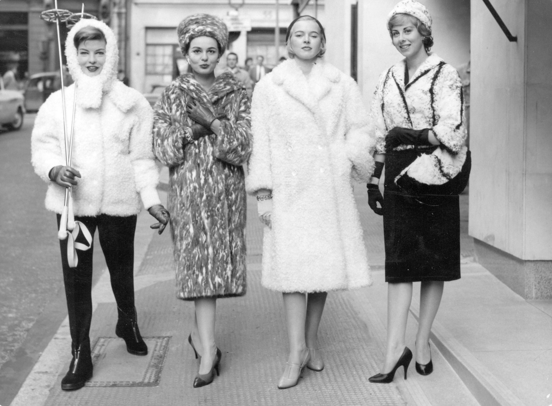 An archival fashion photograph of models in furs.