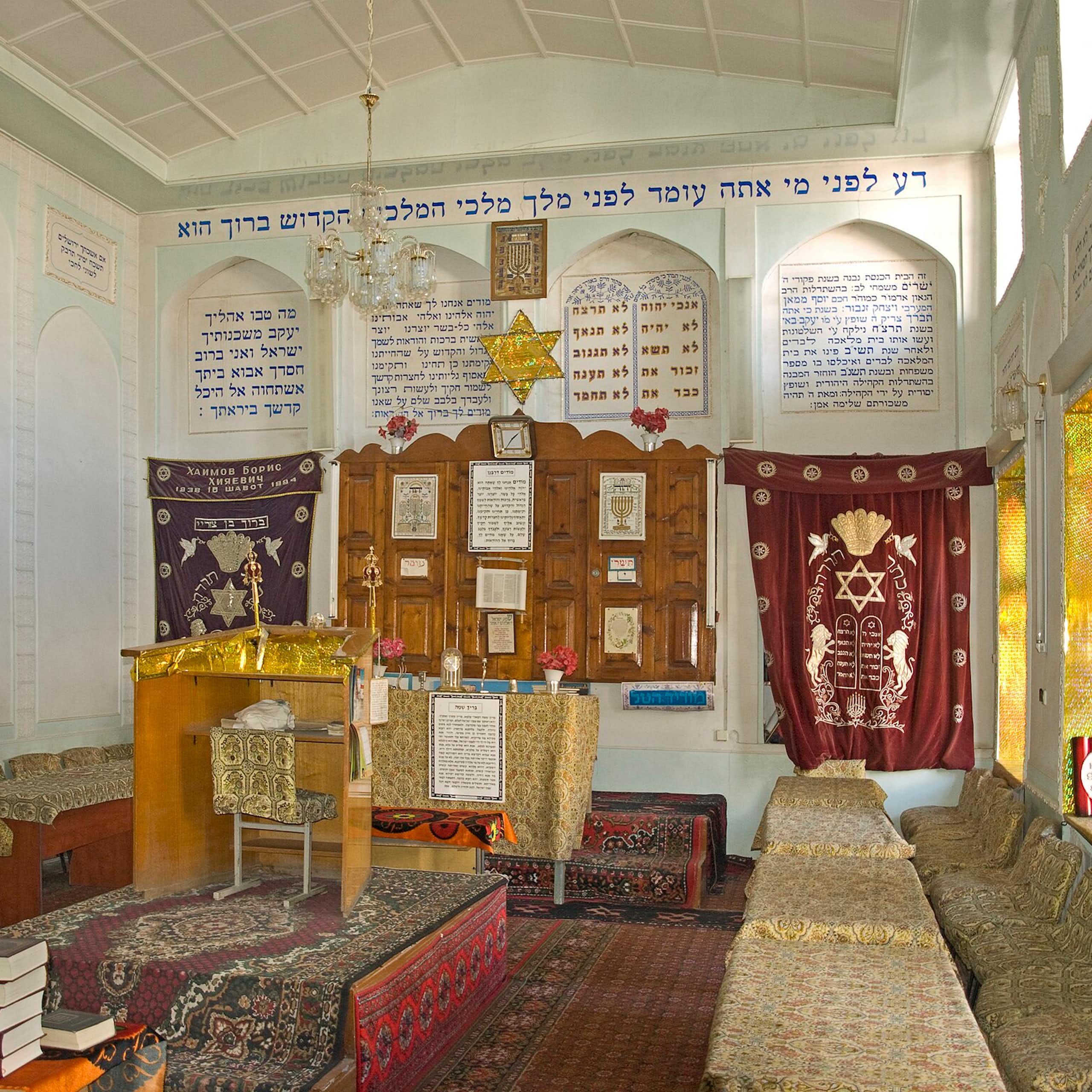 A carpeted interior of a synagogue.