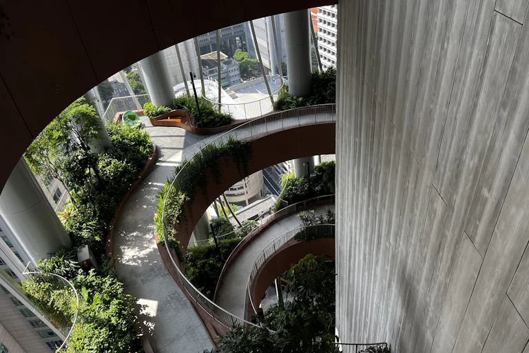 Internal staircase of a building with lots of plants