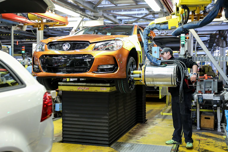 worker assembled car in factory