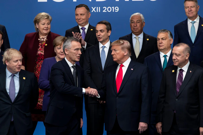 Donald Trump in middle of picture, at Nato meeting in 2019, surrounded by Nato leaders.