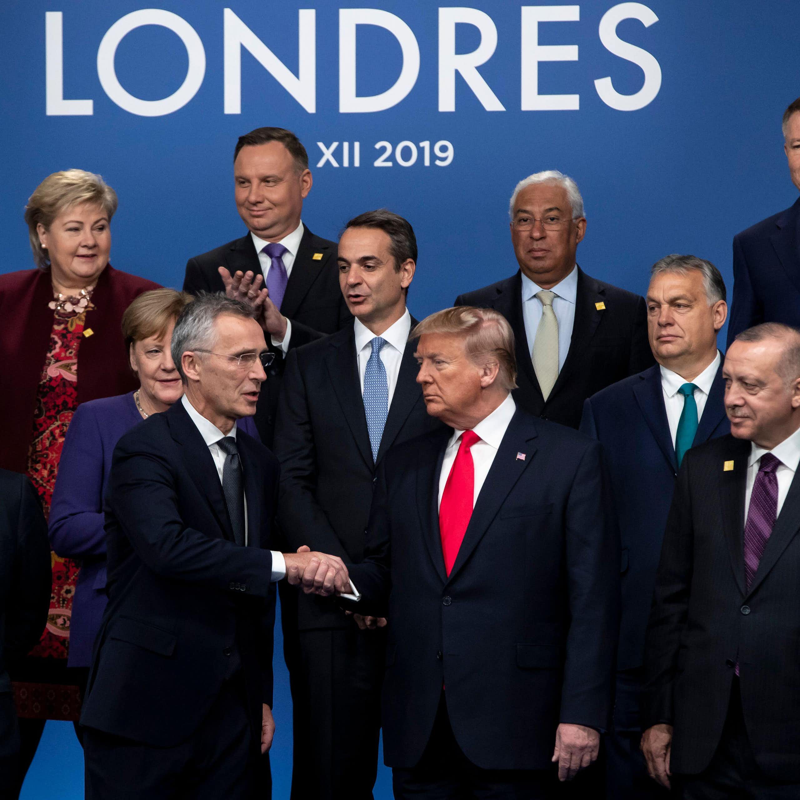 Donald Trump in middle of picture, at Nato meeting in 2019, surrounded by Nato leaders.