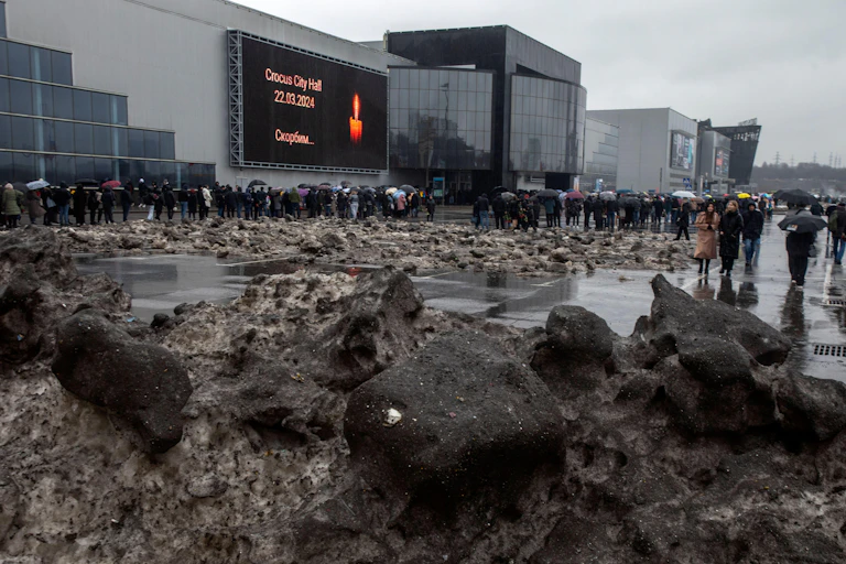 A large queue of mourners near the Crocus City Hall where a terrorist attack took place.