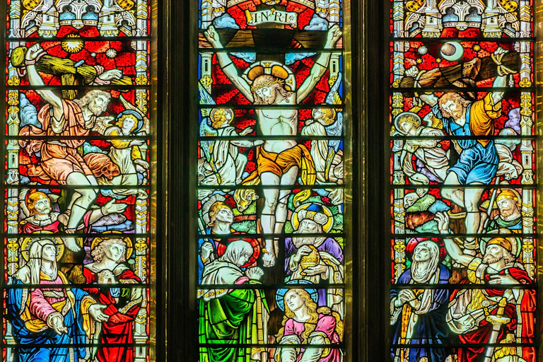 A stained glass window depicting the crucifixion.