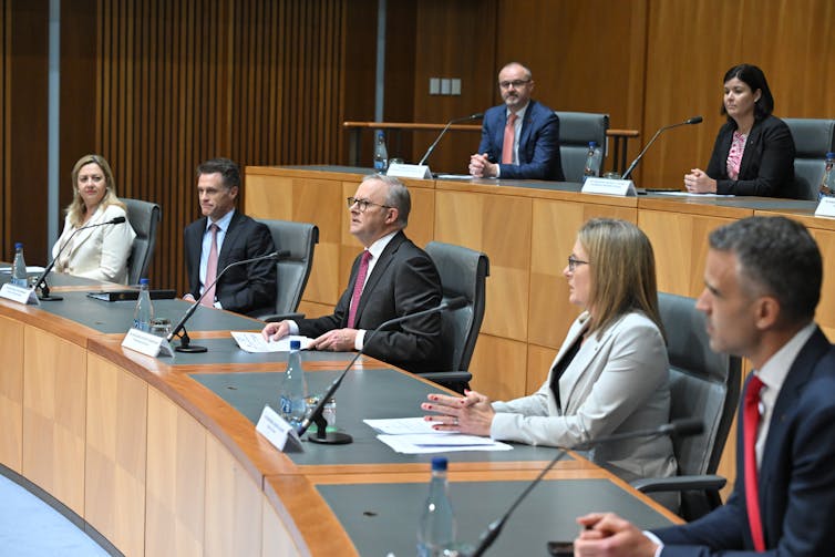 Anthony Albanese surrounded by premiers and chief ministers at a National Cabinet meeting in December 2023.