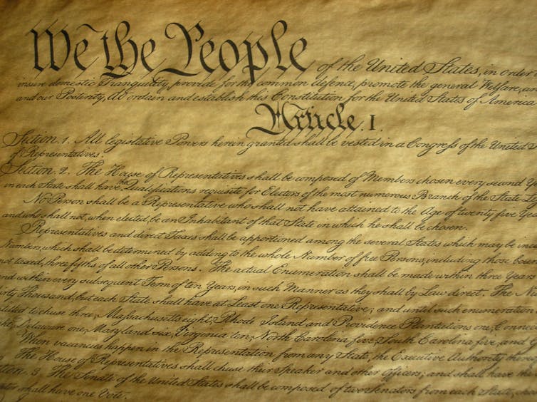 A parchment with fancy handwriting on it.