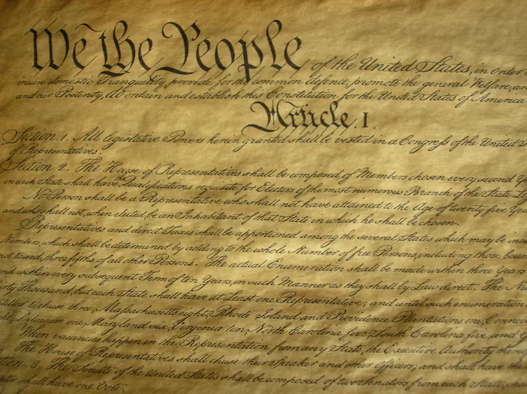 A parchment with fancy handwriting on it.