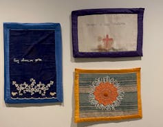 Colourful textiles hanging on walls.