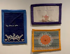 Colourful textiles hanging on walls.