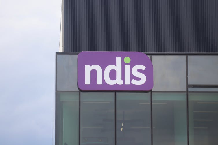 An NDIS sign on a building.