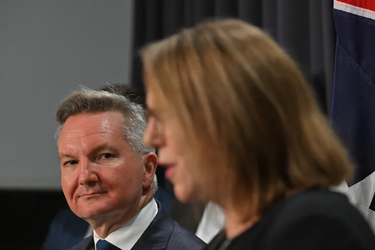 Man looks at woman speaking