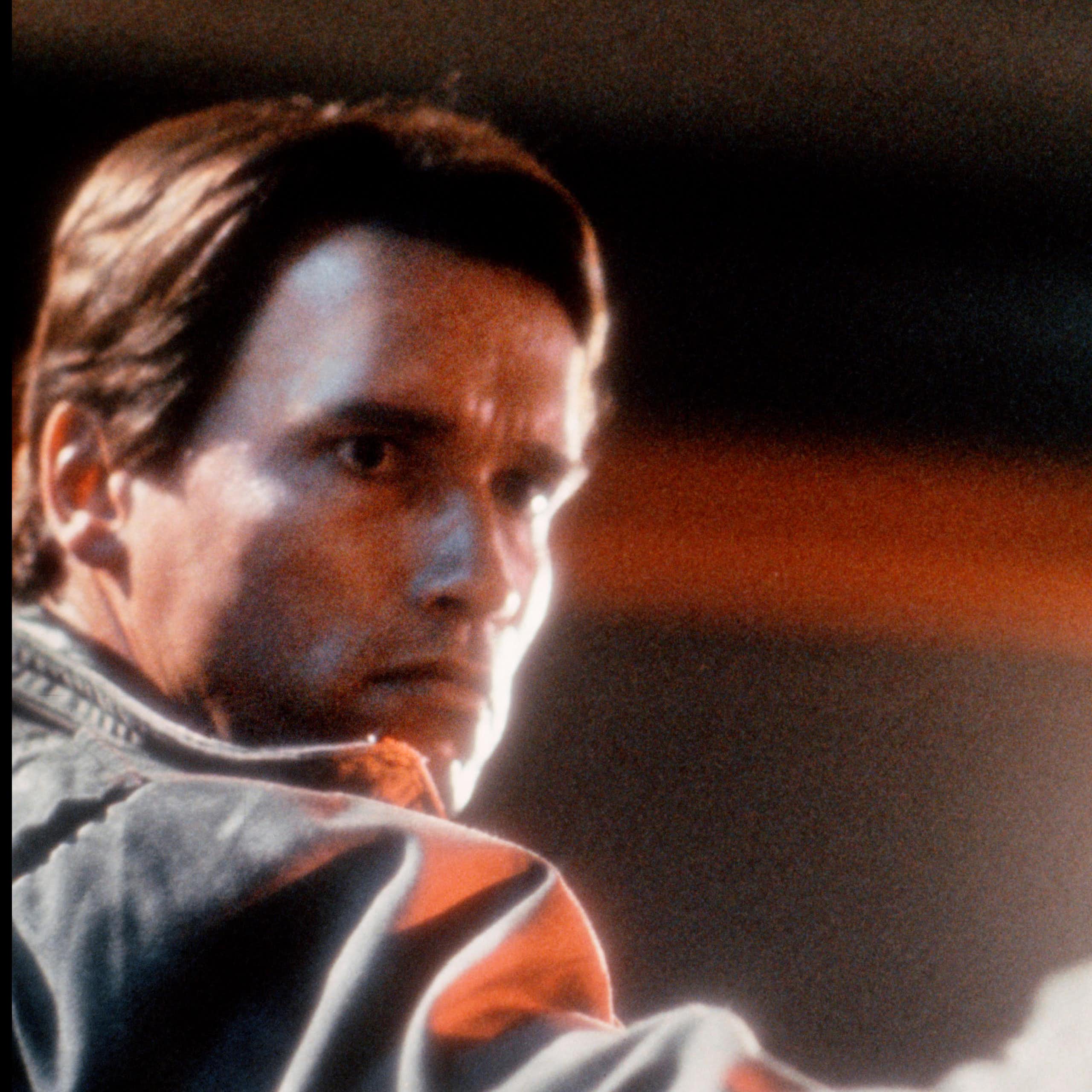 Arnold Schwarzenegger in The Terminator holding a gun