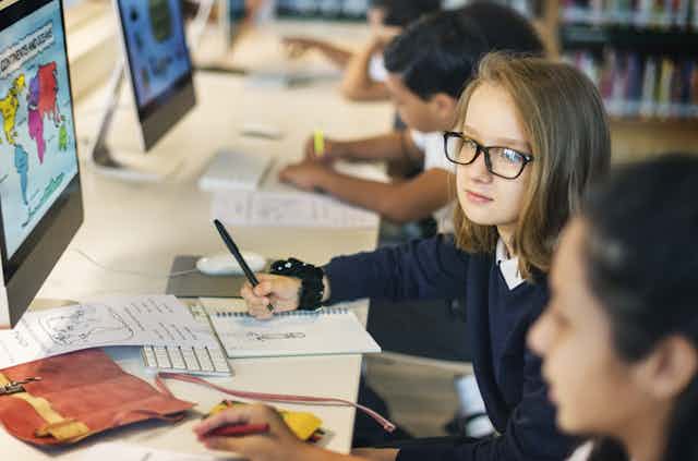 School pupils using computers
