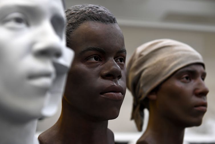 3D models of enslaved African Americans: one a teenage boy, one a woman in her 30s