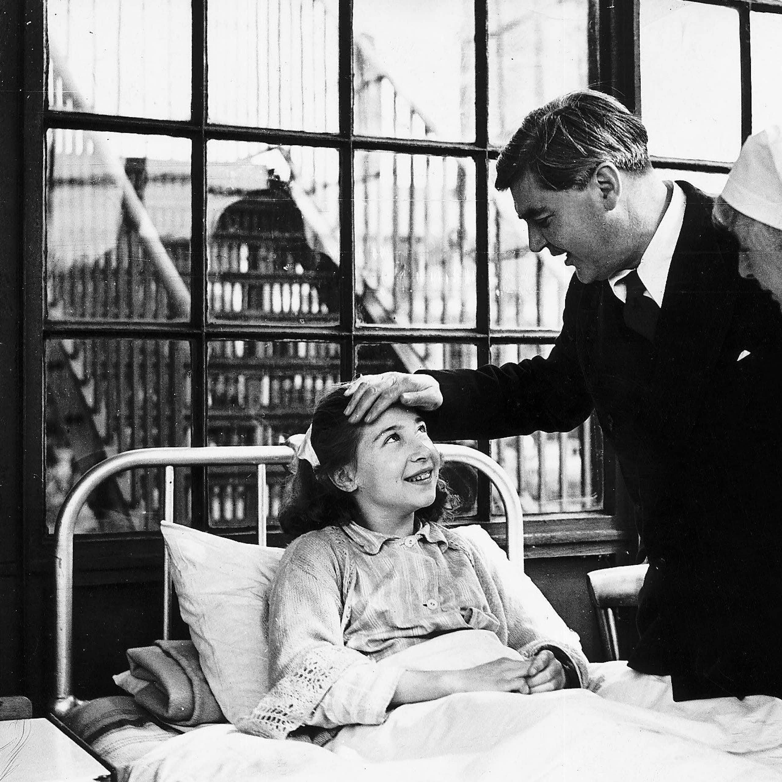 Aneurin Bevan talking to a young female patient