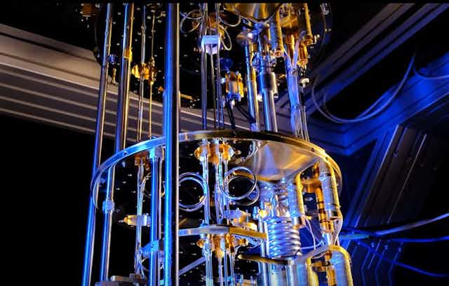 Photo showing a complicated system of metal tubes and pipes used to cool a quantum computer.
