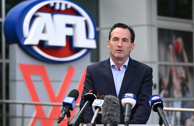 AFL CEO ndrew Dillon speaks to media during a press conference