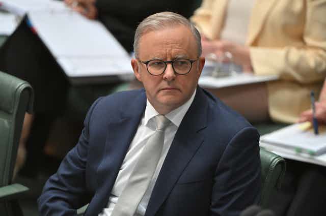 Prime Minister Anthony Albanese looks serious during question time