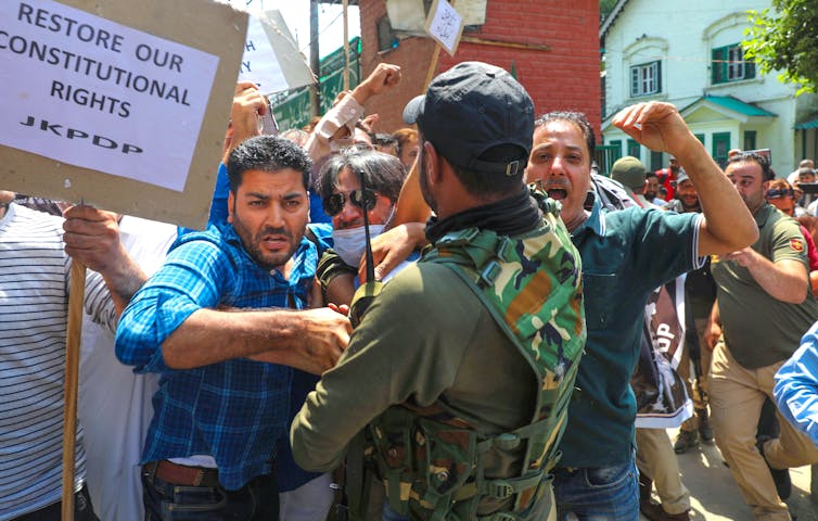 Protest against the revocation of Article 370.