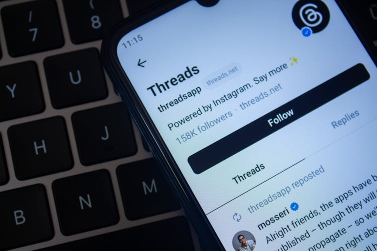 Photo of a smartphone displaying the Threads social app.