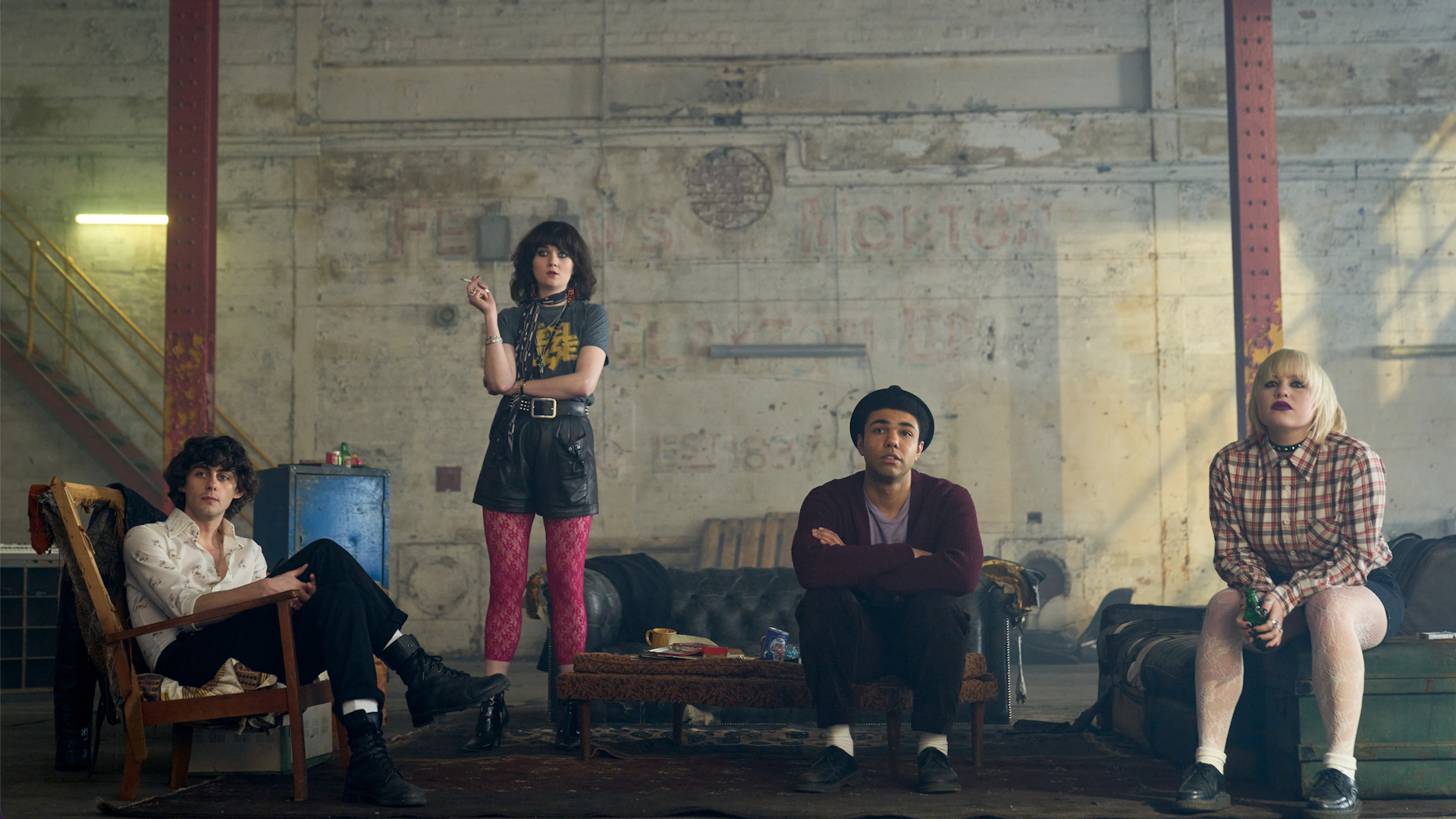 A band of young people, two girls and two boys.