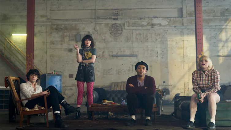 A band of young people, two girls and two boys.