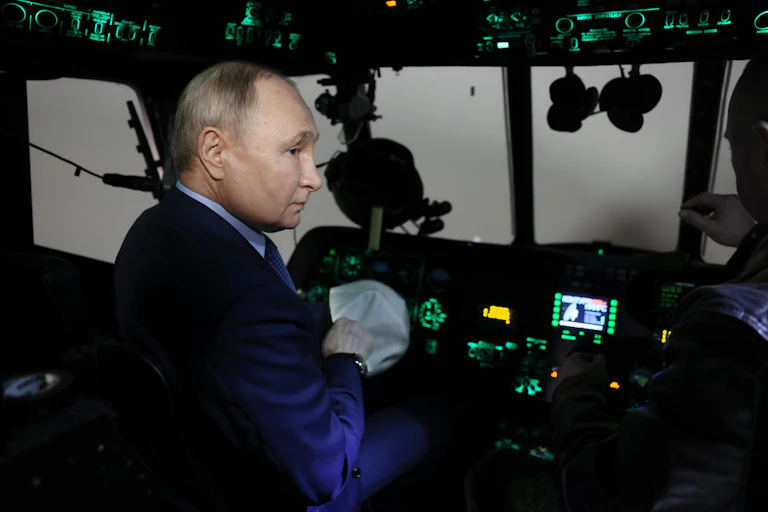 Russian president Vladimir Putin sits in the cockpit of a Russian warplane, March 2024