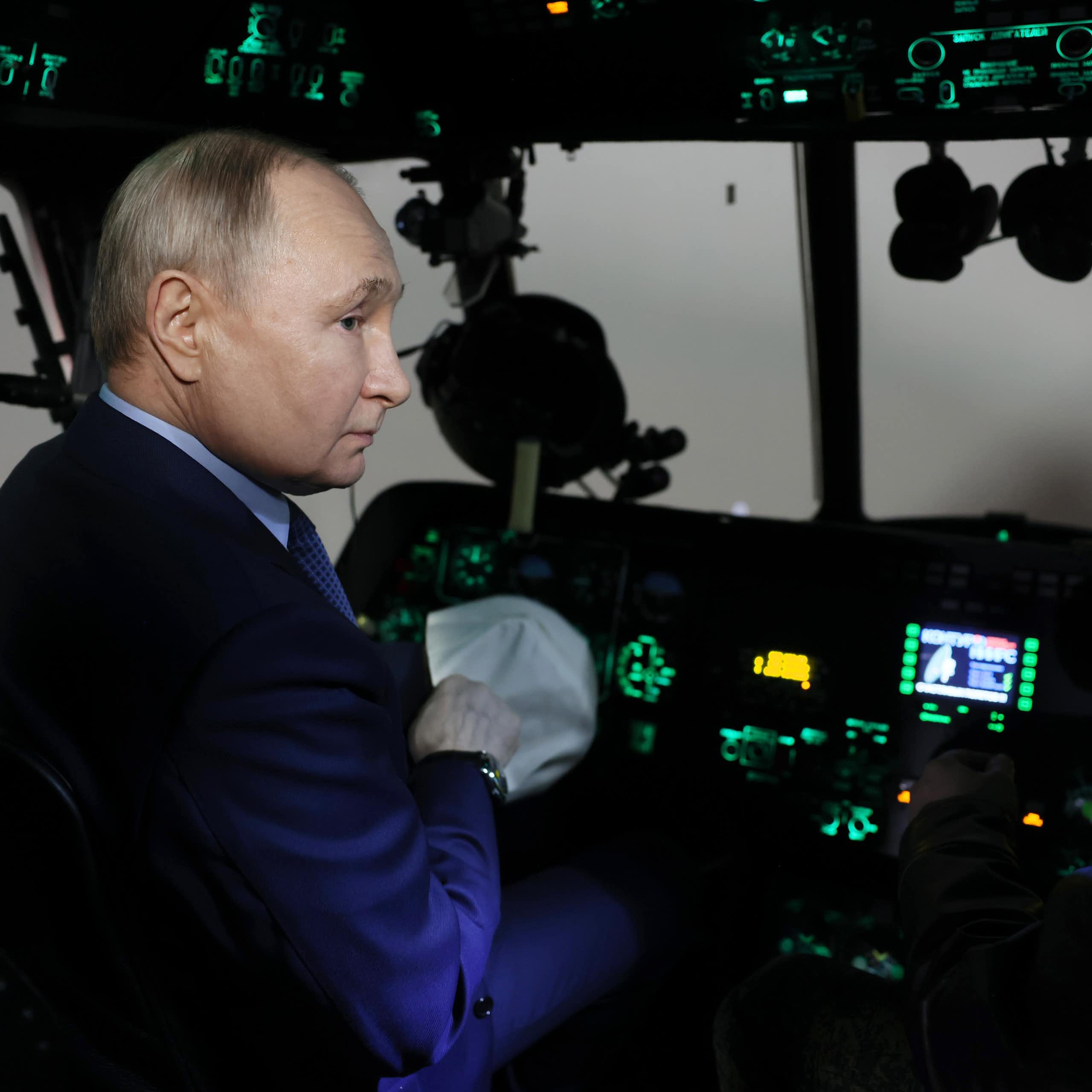 Russian president Vladimir Putin sits in the cockpit of a Russian warplane, March 2024