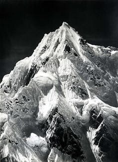 Black and white photo of a snow covered peak