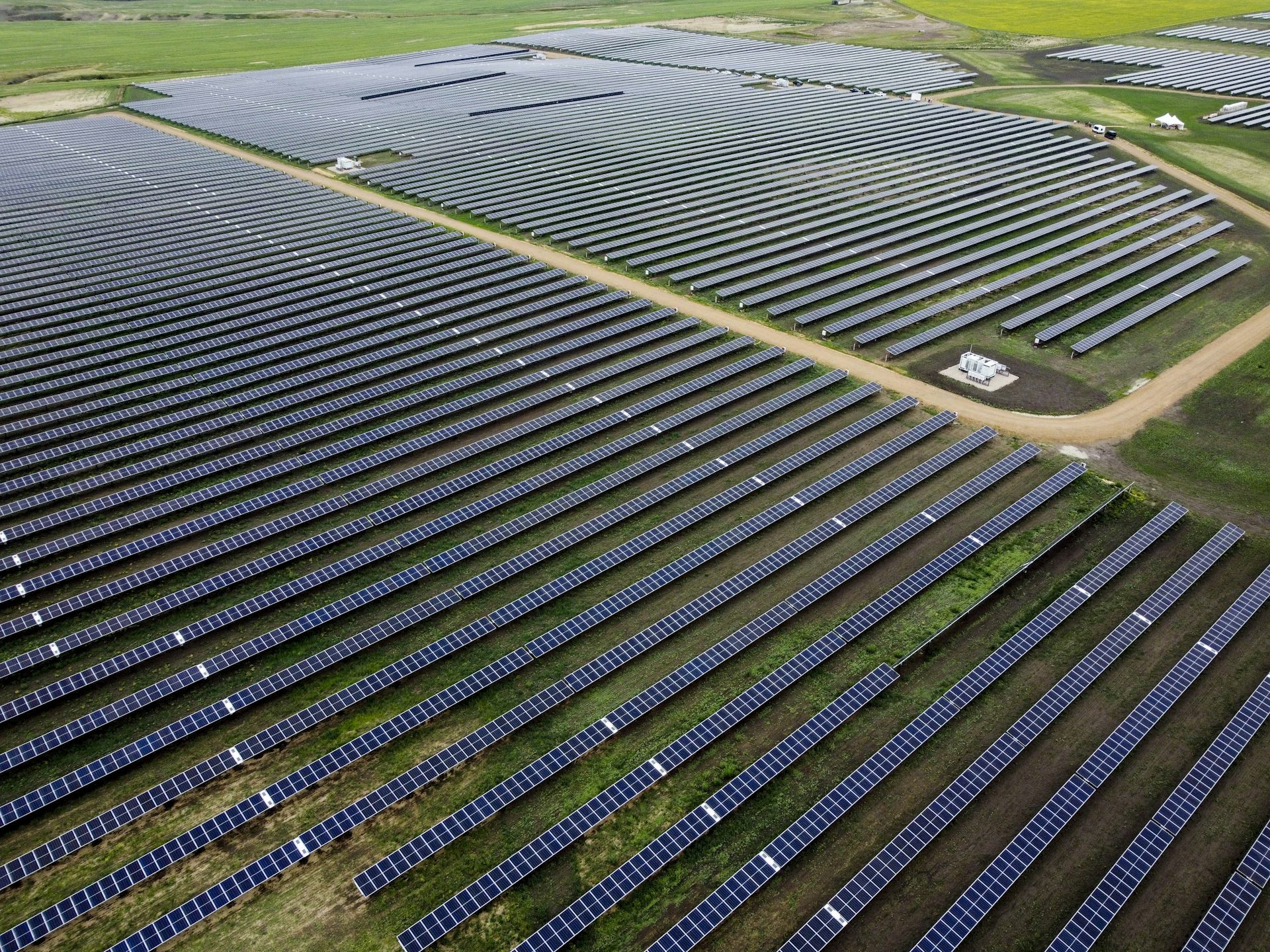A large field of solar panels photographed from above.