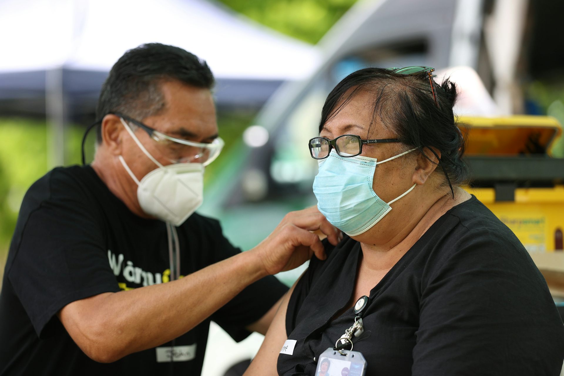 A nurse administering vaccination