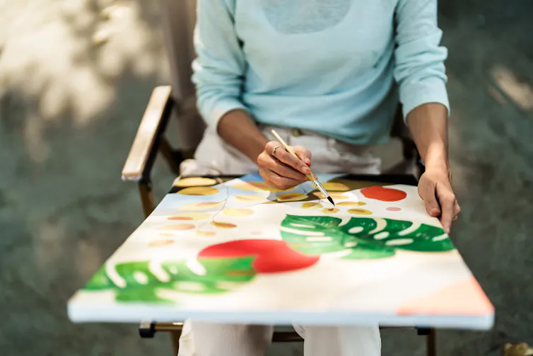 A person painting.