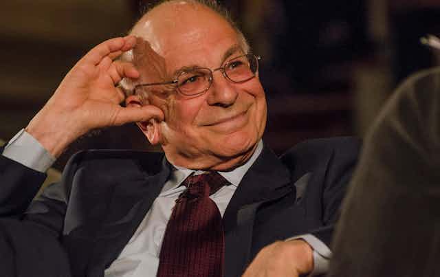 Photo of Daniel Kahneman wearing a suit. 