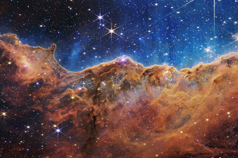 starry sky with clouds in the lower half