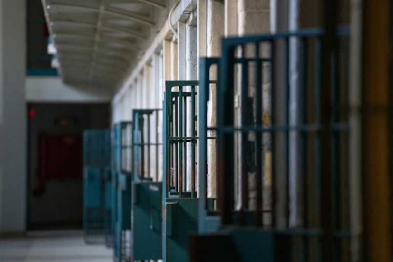 A row of open prison doors