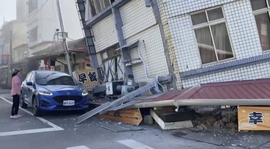 A person surveys earthquake damage in Taiwan.