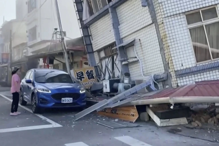 A person surveys earthquake damage in Taiwan.