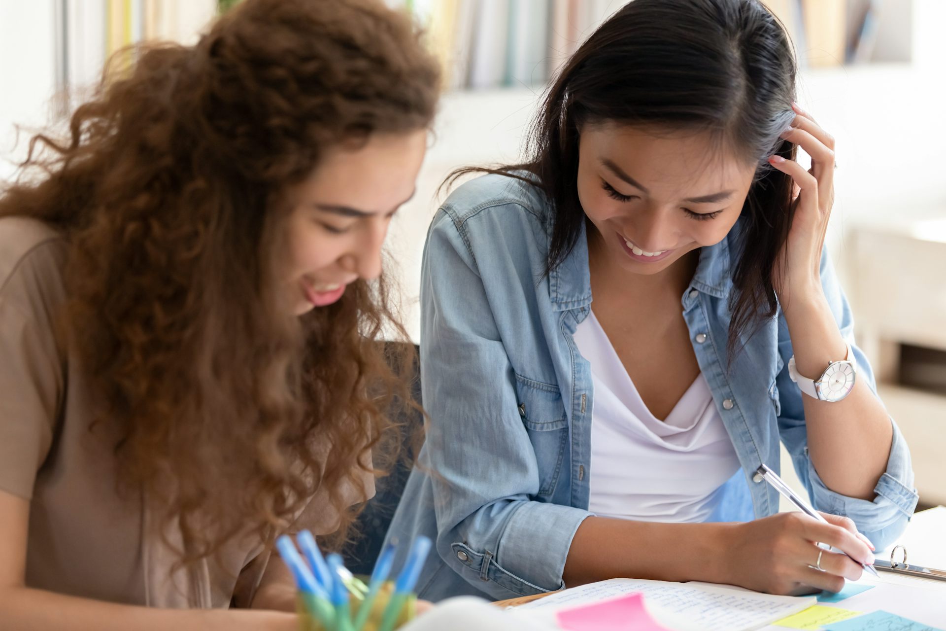 Two female students working together on assignment