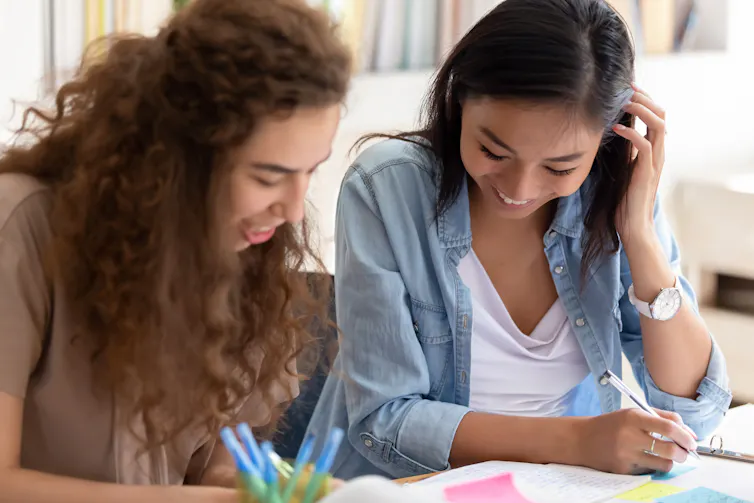 Two female students working together on assignment