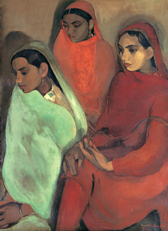 A painting of three young Indian women seated, wearing brightly coloured saris.